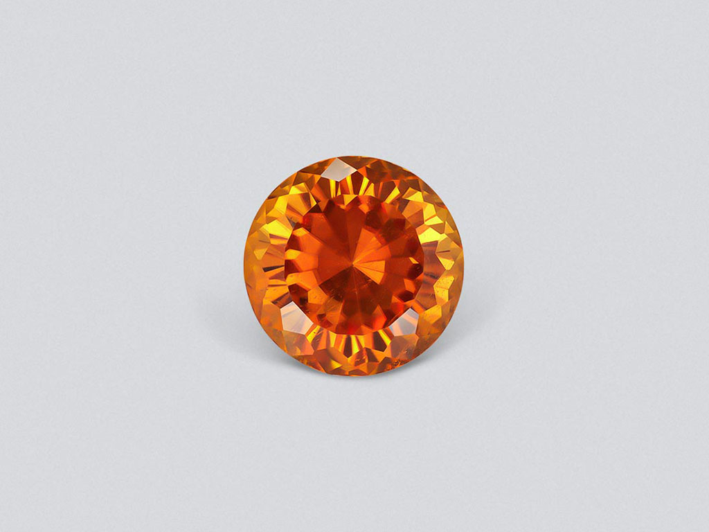 Vivid orange clinohumite 3.88 carats in round cut, Afghanistan