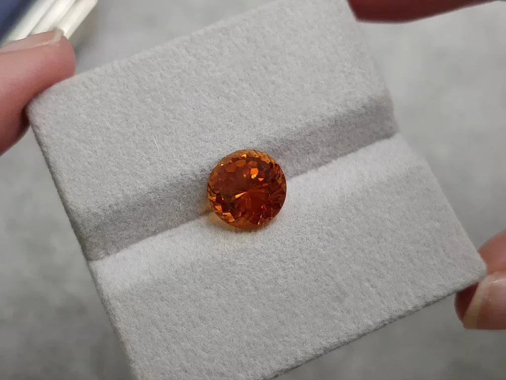Vivid orange clinohumite 3.88 carats in round cut, Afghanistan 3