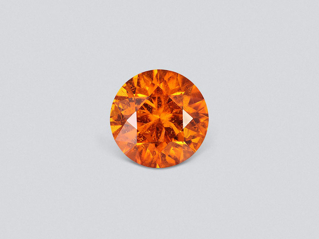Vivid orange clinohumite 4.24 ct in round cut, Afghanistan